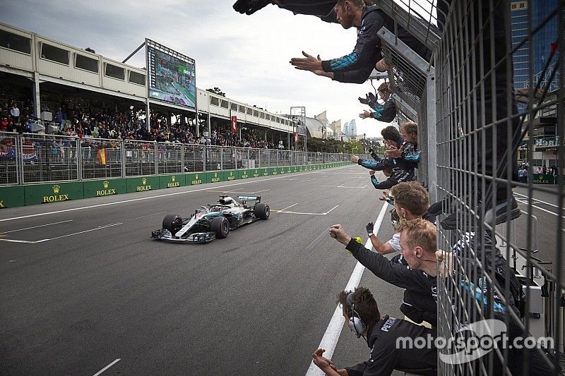 Lewis Hamilton, Mercedes AMG F1 W09, crosses the line for victory to the delight of his team