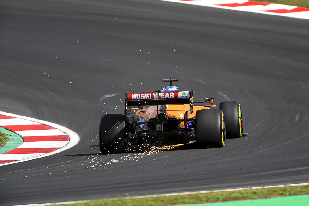 Sparks trail from Daniel Ricciardo, McLaren MCL35M