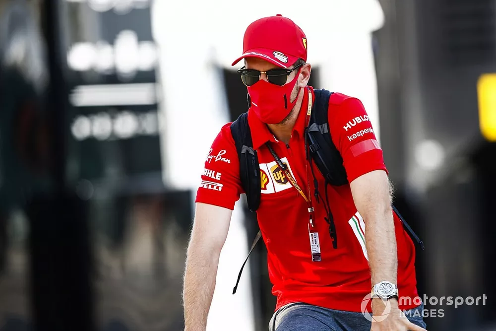 Sebastian Vettel, Ferrari arrives on a bike 