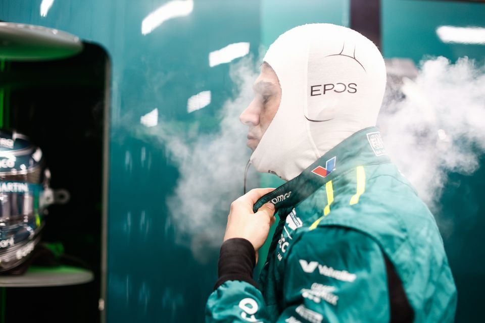 Lance Stroll, Aston Martin F1 Team, puts on his balaclava