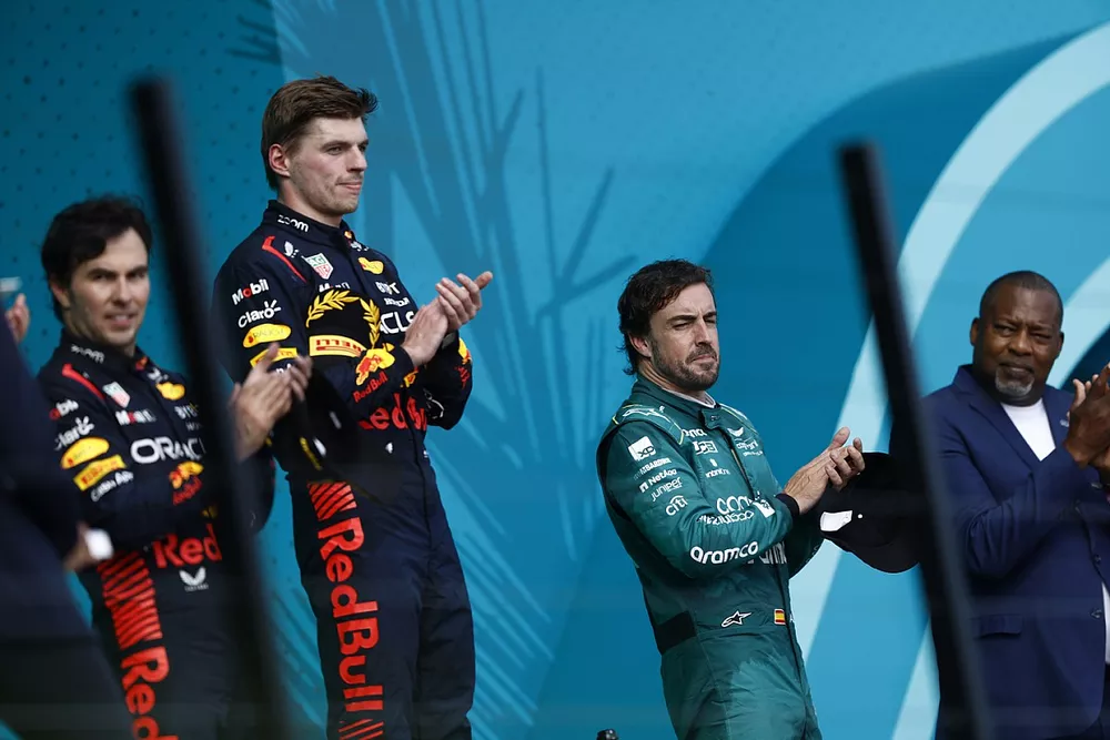 Sergio Perez, Red Bull Racing, 2nd position, Max Verstappen, Red Bull Racing, 1st position, Fernando Alonso, Aston Martin F1 Team, 3rd position, on the podium