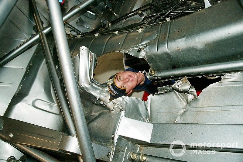 Mark Winterbottom,  Orrcon Racing looks through the hole made in the floor of his Ford after running over a grill