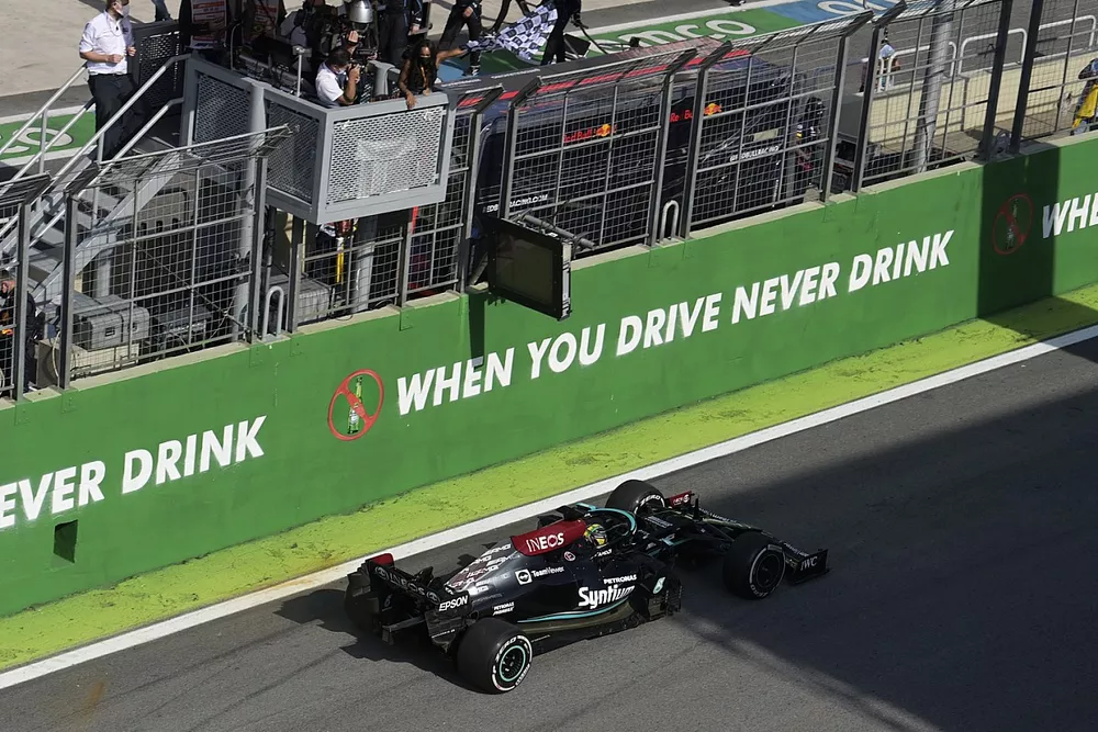 Lewis Hamilton, Mercedes W12, 1st position, crosses the line for victory