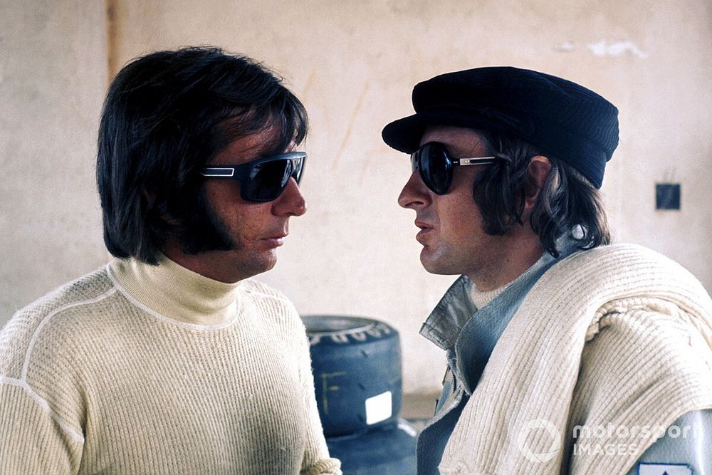 Emerson Fittipaldi, Lotus talks with Jackie Stewart, Tyrrell