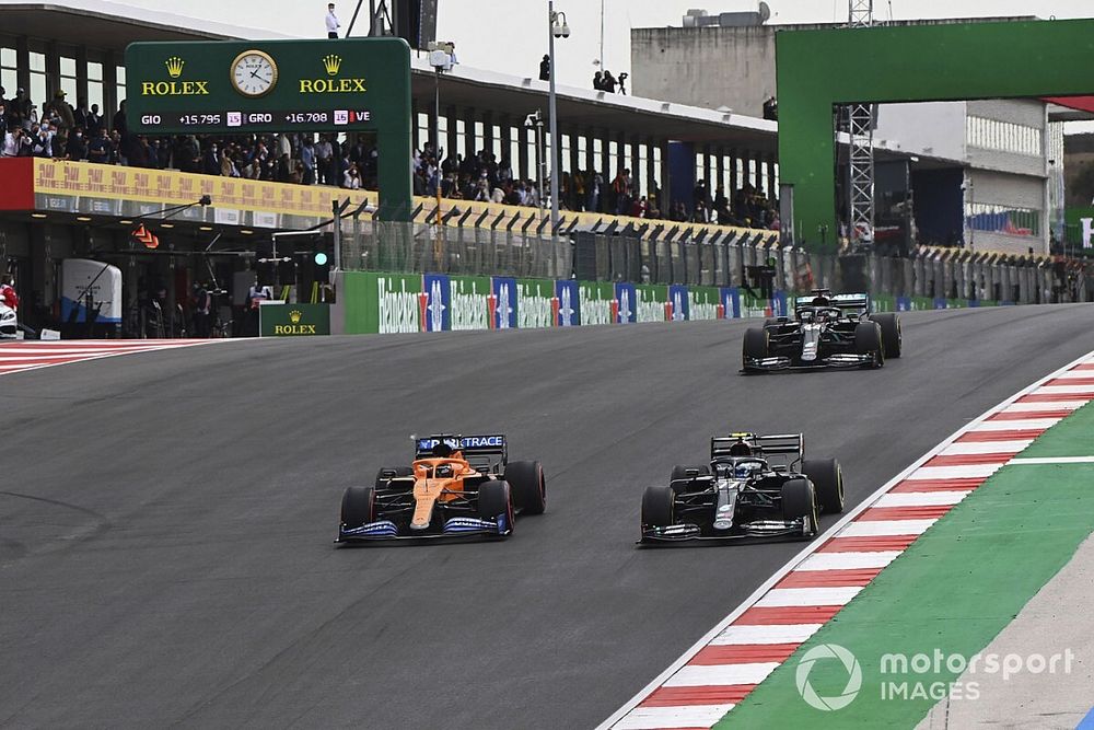 Carlos Sainz Jr., McLaren MCL35, Valtteri Bottas, Mercedes F1 W11, and Lewis Hamilton, Mercedes F1 W11