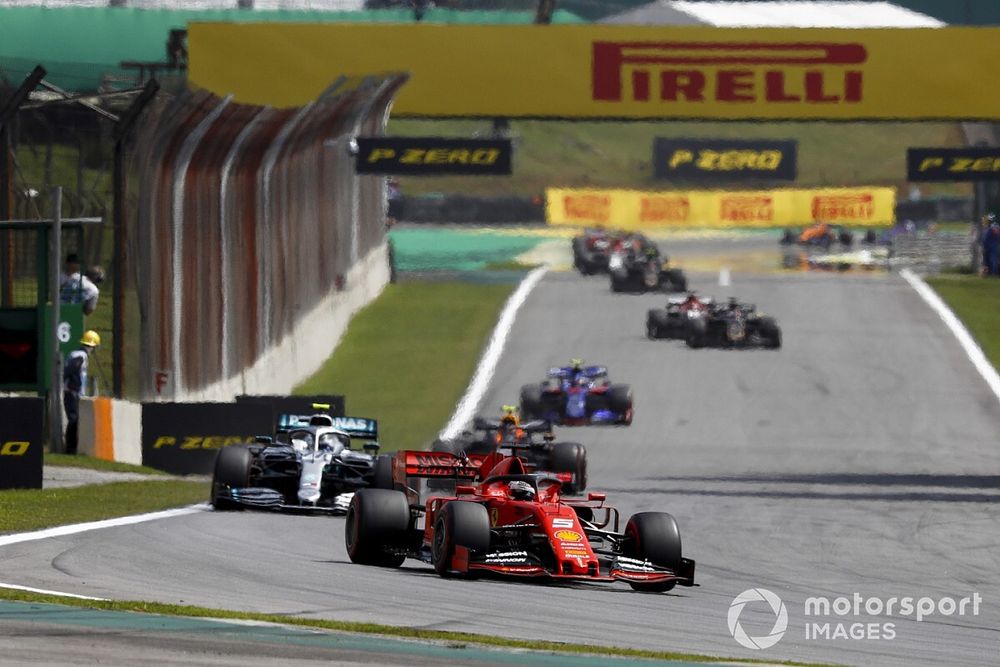 Sebastian Vettel, Ferrari SF90, leads Valtteri Bottas, Mercedes AMG W10