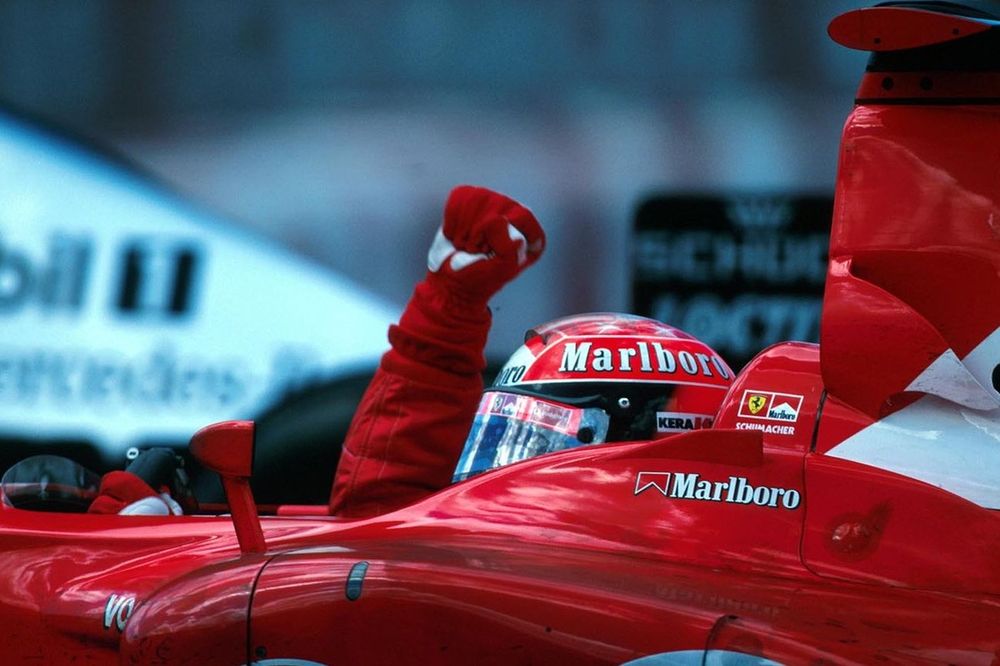 Michael Schumacher, celebrates the 150th GP victory for the Ferrari team