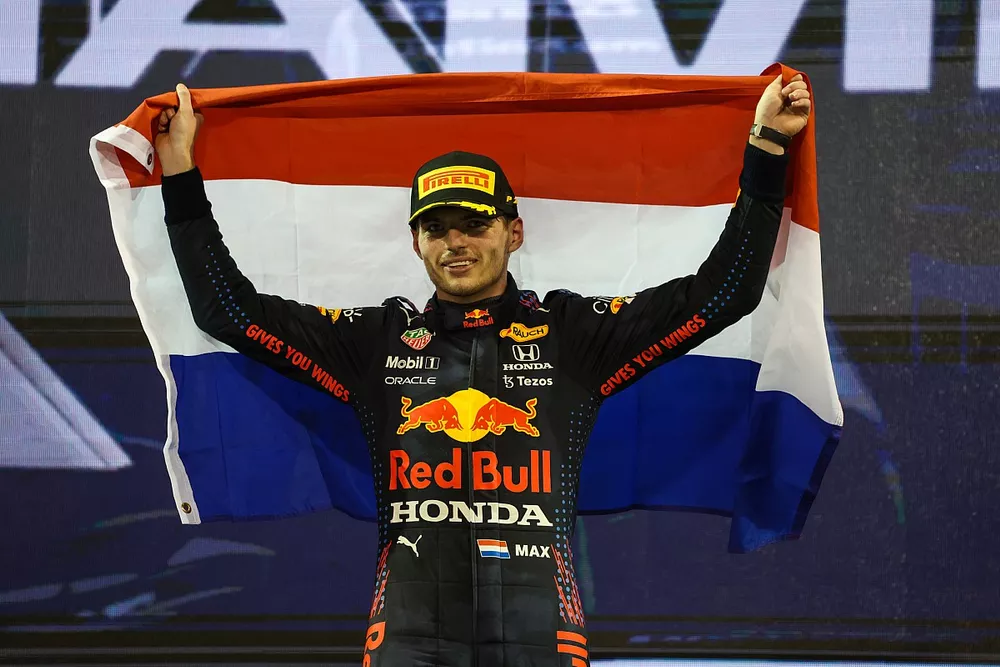 2021 drivers champion Max Verstappen, Red Bull Racing, 1st position, celebrates on the podium with a Dutch flag