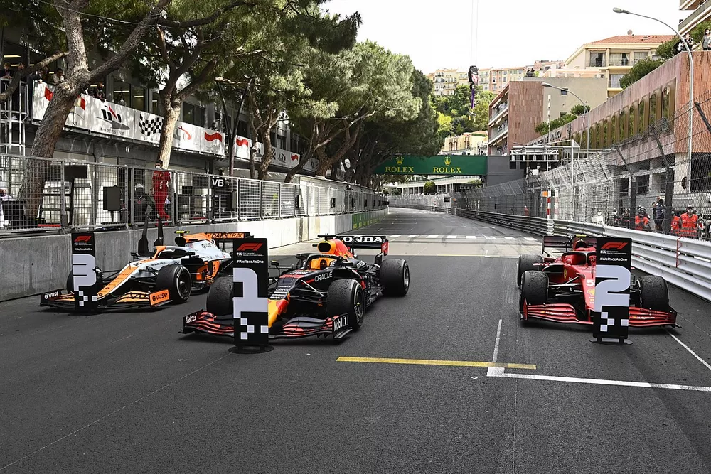 The cars of Lando Norris, McLaren MCL35M, 3rd position, Max Verstappen, Red Bull Racing RB16B, 1st position, and Carlos Sainz Jr., Ferrari SF21, 2nd position, in Parc Ferme