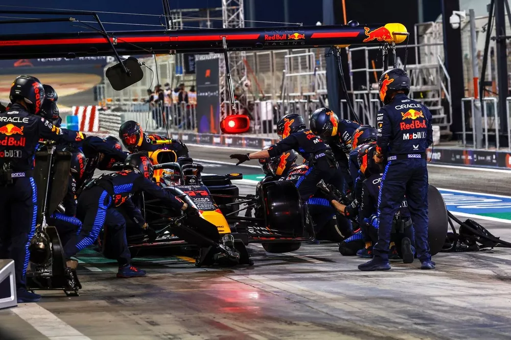 Sergio Perez, Red Bull Racing RB20 in the pit lane 