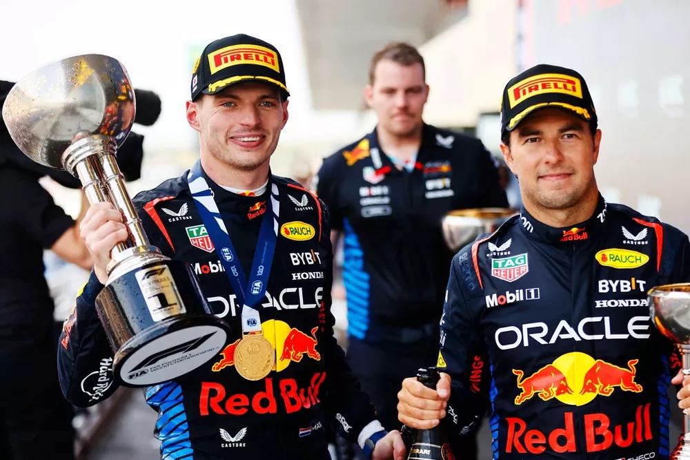 Max Verstappen, Red Bull Racing, 1st position, and Sergio Perez, Red Bull Racing, 2nd position, leave the podium with their trophies