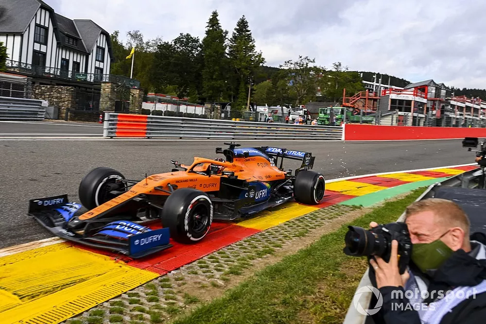 Carlos Sainz Jr., McLaren MCL35, passes a photographer