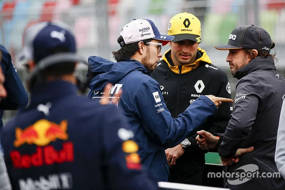 Sergio Perez, Force India, Carlos Sainz Jr., Renault Sport F1 Team, and Fernando Alonso, McLaren, talk at the drivers parade
