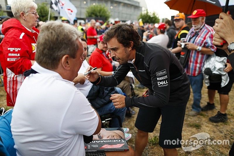 Fernando Alonso, McLaren, meets some fans