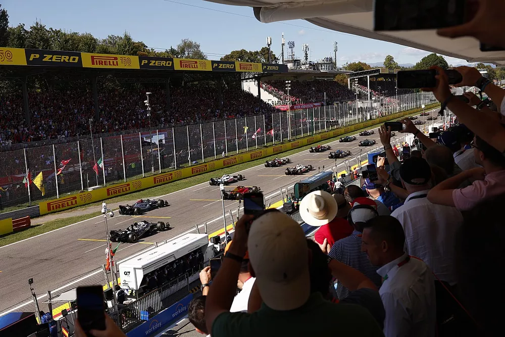Fans look on as the grid launches for the start