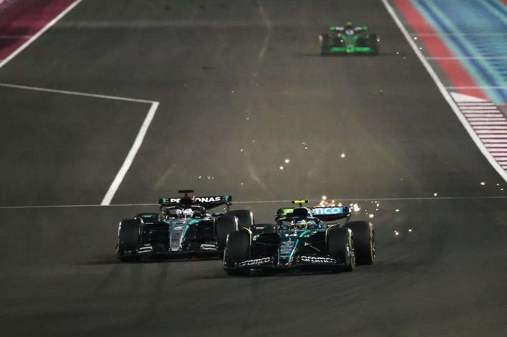 Fernando Alonso, Aston Martin AMR24, battles with George Russell, Mercedes F1 W15