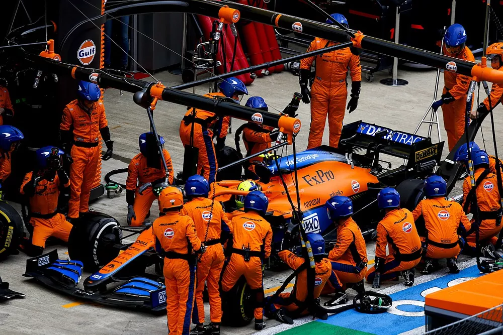 Lando Norris, McLaren MCL35M, makes a pit stop