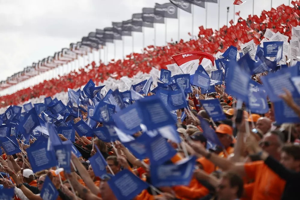 Fans form the Dutch colours in a grandstand