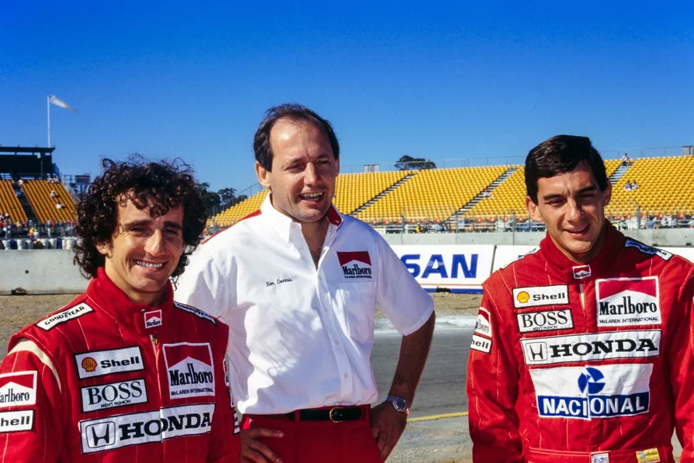 Alain Prost, Ron Dennis, and Ayrton Senna.