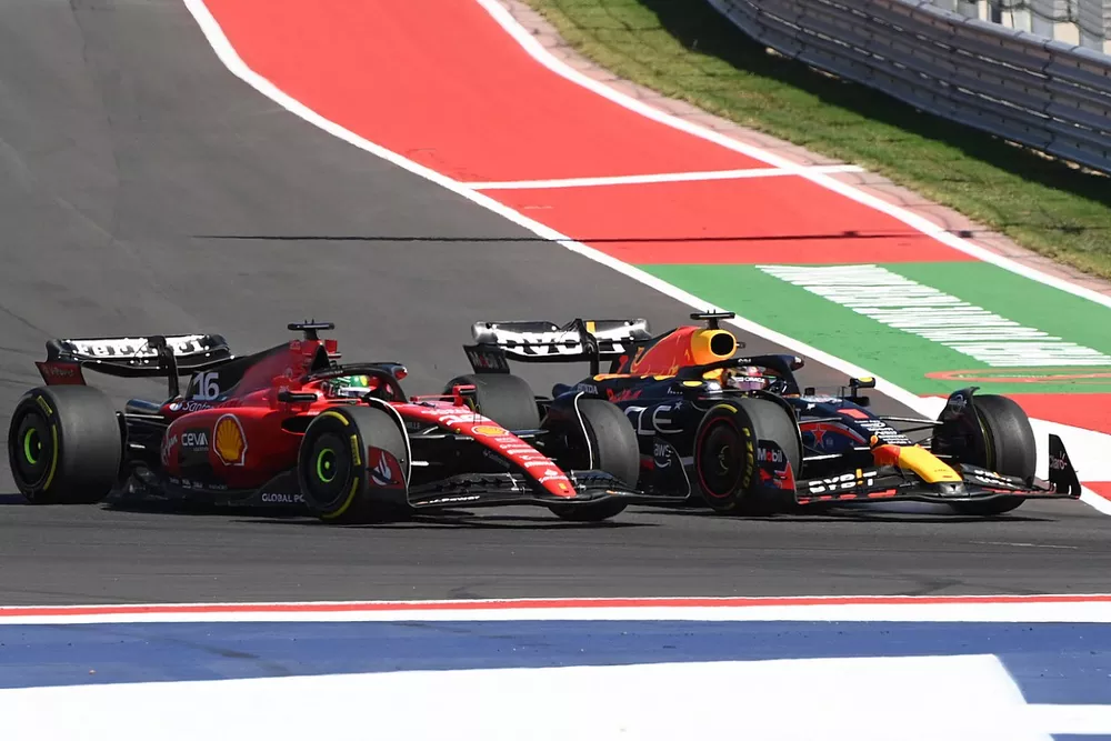 Max Verstappen, Red Bull Racing RB19, passes Charles Leclerc, Ferrari SF-23
