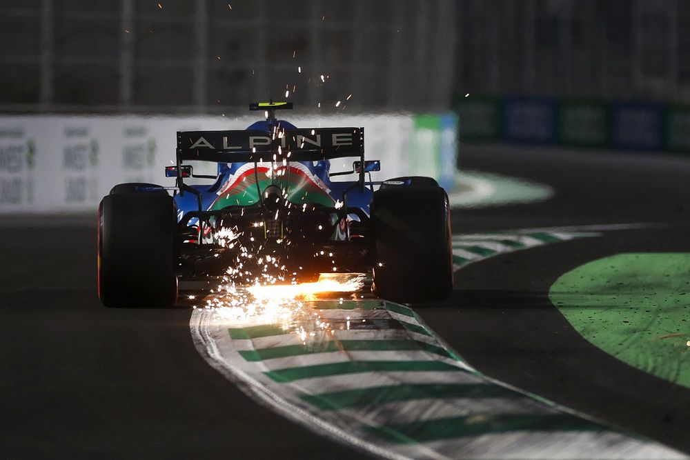 Sparks kick up from Esteban Ocon, Alpine A521