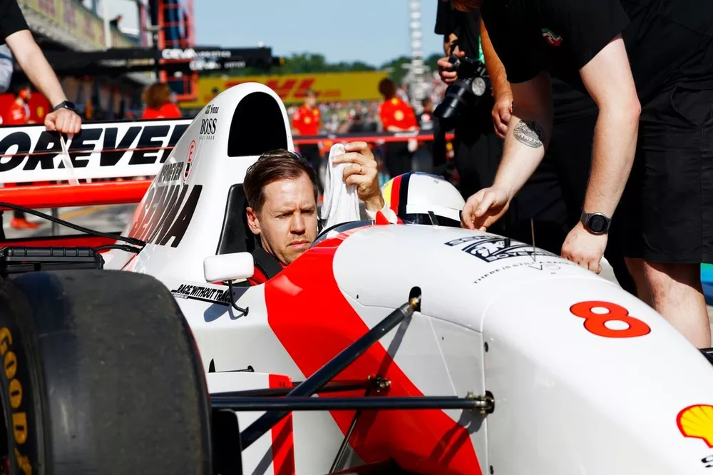 Sebastian Vettel prepares to drive Ayrton Senna's McLaren MP4/8