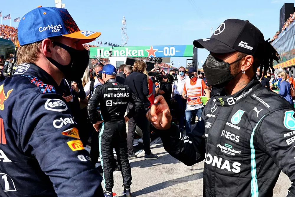 Max Verstappen, Red Bull Racing, 1st position, and Lewis Hamilton, Mercedes, 2nd position, talk after the race