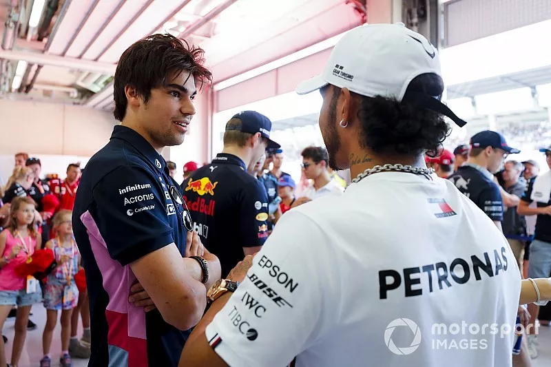 Lance Stroll, Racing Point, talks with Lewis Hamilton, Mercedes AMG F1