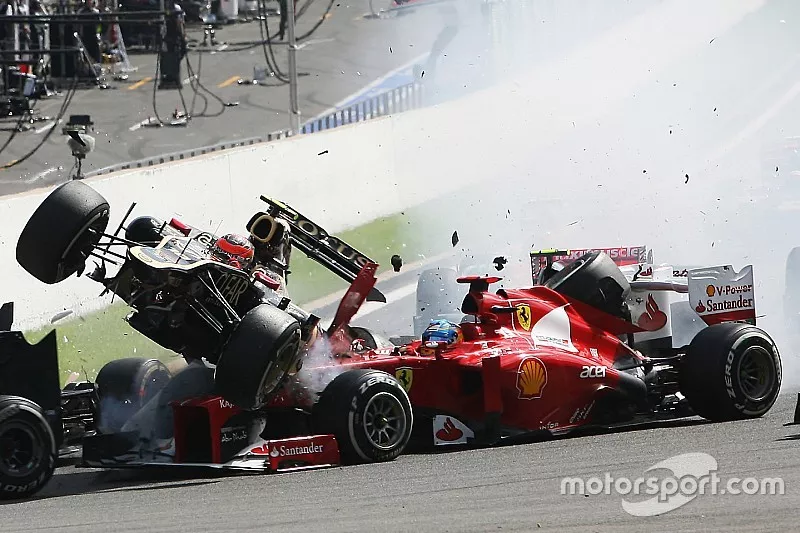 A crash at the start involving Lewis Hamilton, McLaren, Romain Grosjean, Lotus F1, Fernando Alonso, Ferrari, Kamui Kobayashi, Sauber