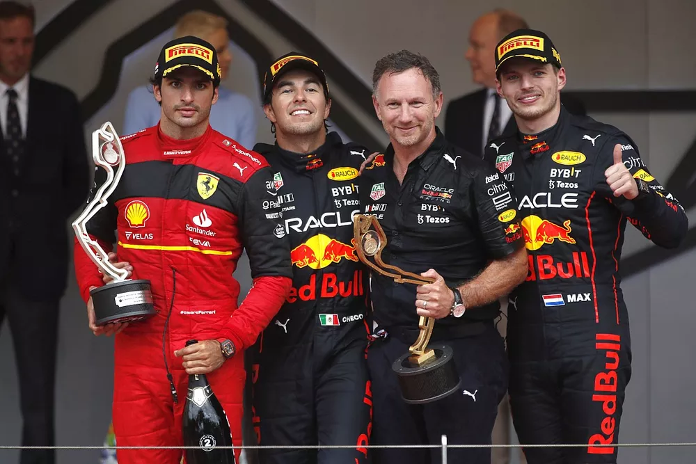 Carlos Sainz, Ferrari, 2nd position, Sergio Perez, Red Bull Racing, 1st position, Christian Horner, Team Principal, Red Bull Racing, Max Verstappen, Red Bull Racing, 3rd position, on the podium