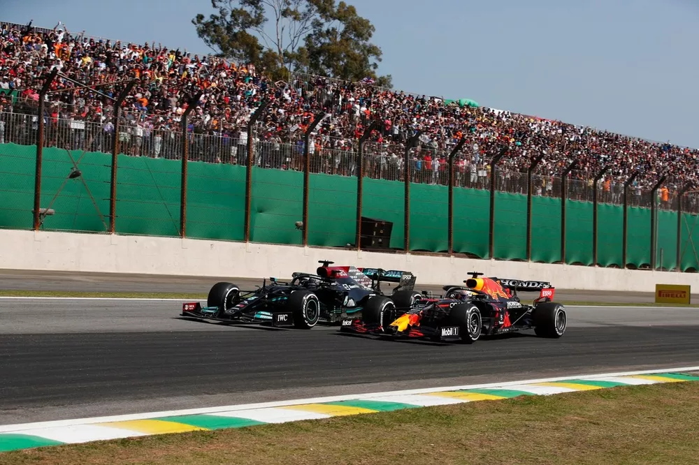 Max Verstappen, Red Bull Racing RB16B, battles with Lewis Hamilton, Mercedes W12