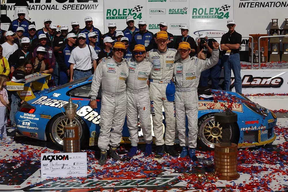 The overall winners, Michael Schrom, Kevin Buckler, Timo Bernhard, Jorg Bergmeister, TRG Porsche