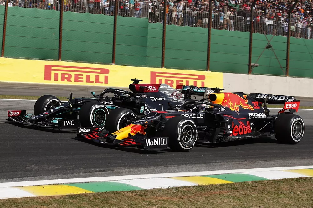 Max Verstappen, Red Bull Racing RB16B, battles with Lewis Hamilton, Mercedes W12