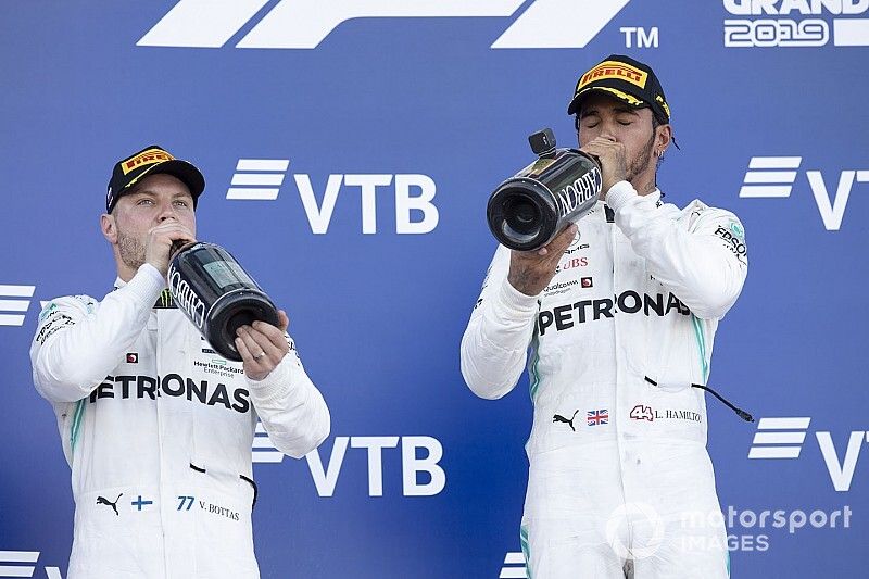 second place Valtteri Bottas, Mercedes AMG W10 and race winner Lewis Hamilton, Mercedes AMG F1 W10 drink champagne on the podium