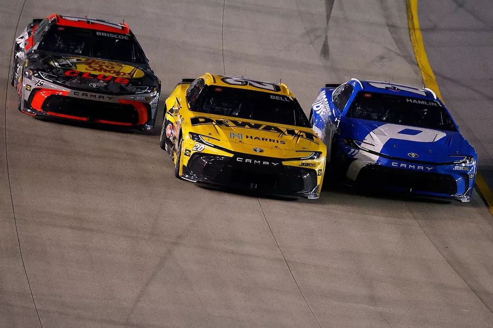 Three-wide battle for the win between Chase Briscoe, No. 19 Joe Gibbs Racing Toyota; Christopher Bell, No. 20 Joe Gibbs Racing Toyota; Denny Hamlin, No. 11 Joe Gibbs Racing Toyota
