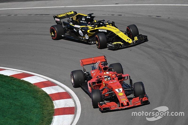 Sebastian Vettel, Ferrari SF71H y Nico Hulkenberg, Renault Sport F1 Team R.S. 18