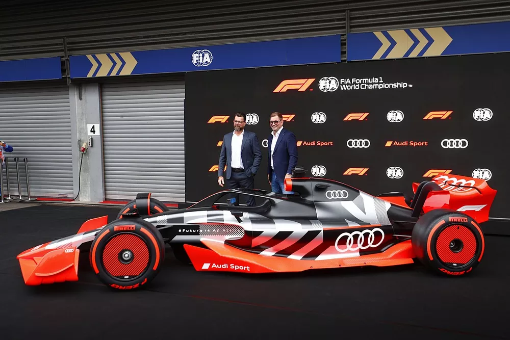 Oliver Hoffmann, Head of Technical Development at Audi Sport GmbH, with Markus Duesmann, Chairman of the Board of Management of Audi AG with the new Audi Sport F1 concept car