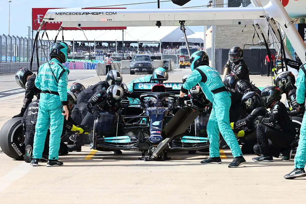 Lewis Hamilton, Mercedes W12, makes a pit stop