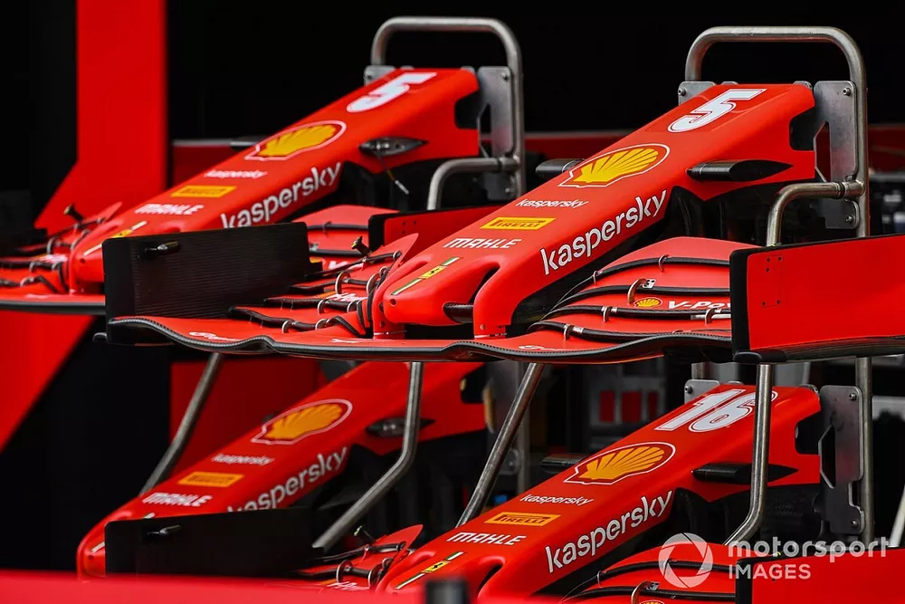 Ferrari nose coses and front wings in the pit lane