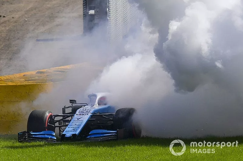 Robert Kubica, Williams FW42, parks up with technical issues and a large plume of smoke
