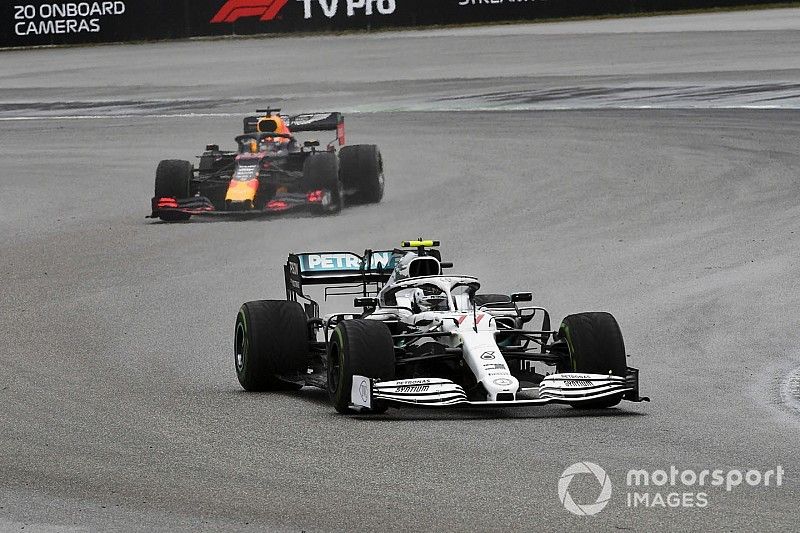 Valtteri Bottas, Mercedes AMG W10, leads Max Verstappen, Red Bull Racing RB15