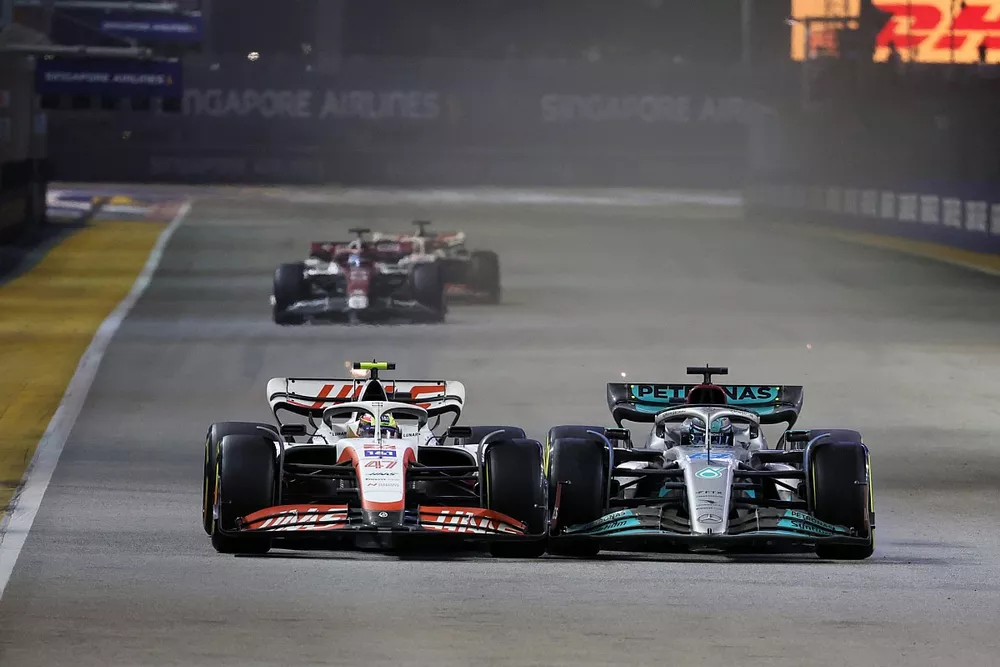 Mick Schumacher, Haas VF-22, battles with George Russell, Mercedes W13