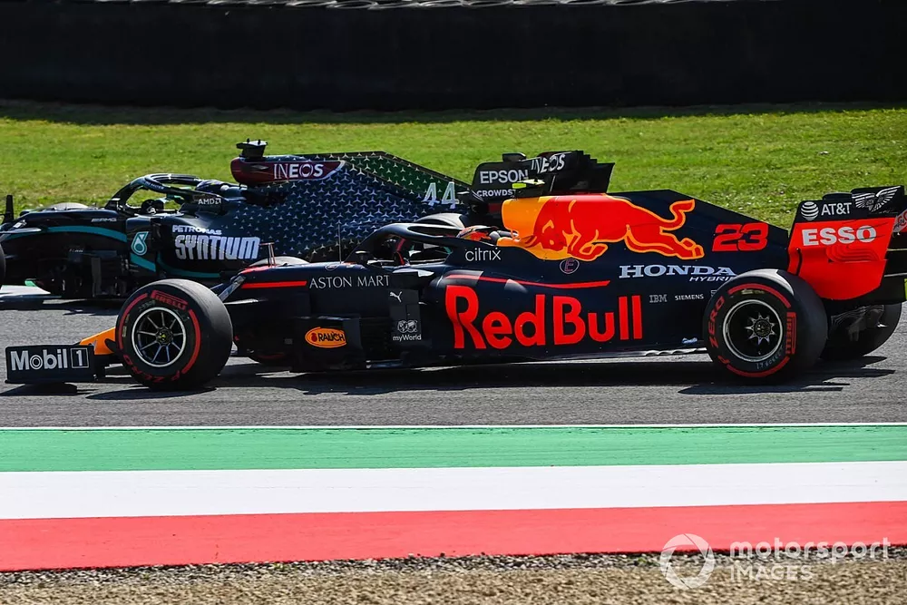 Lewis Hamilton, Mercedes F1 W11, passes Alex Albon, Red Bull Racing RB16