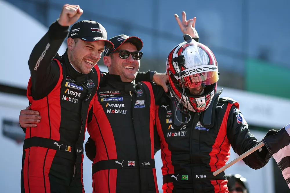 Laurens Vanthoor, Nick Tandy and Felipe Nasr drivers of The #7 Porsche Penske Motorsports Porsche 963 celebrate winning the Rolex 24
