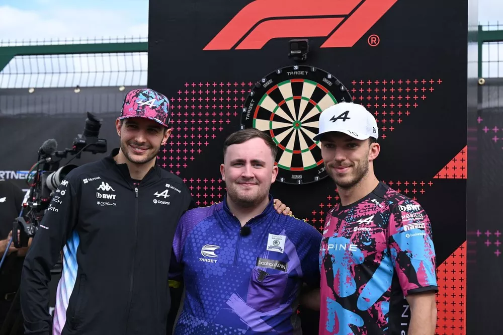Esteban Ocon, Alpine F1 Team, with Luke Littler, English darts player, & Pierre Gasly, Alpine F1 Team 