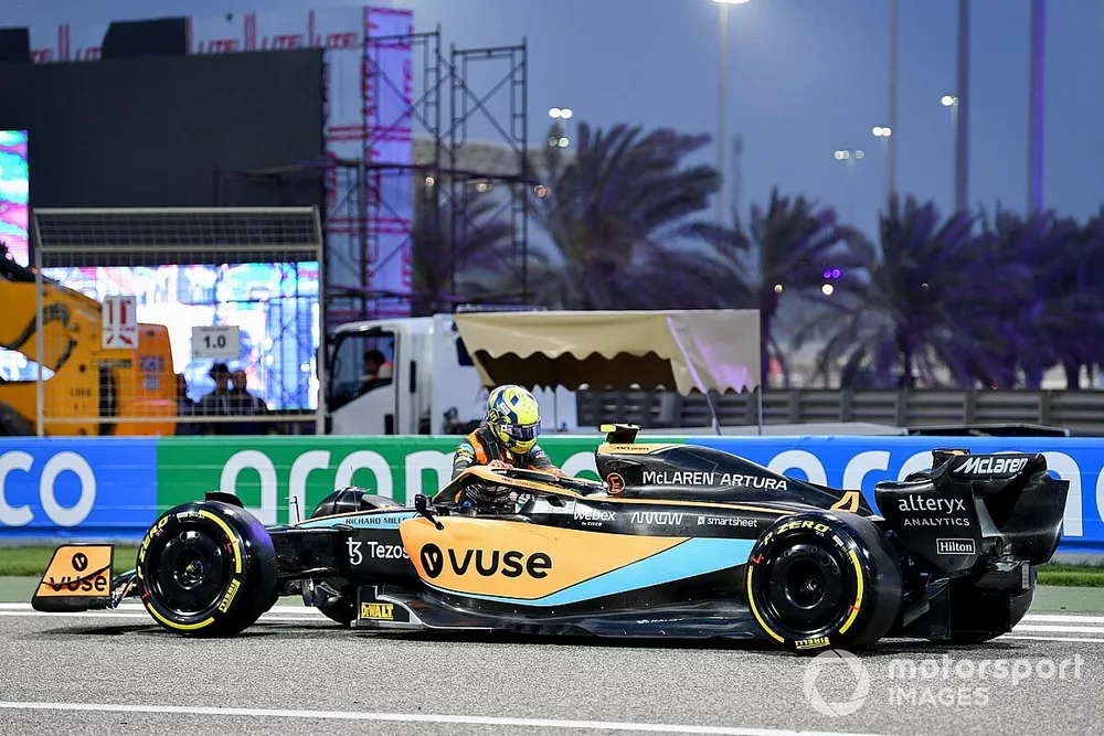 Lando Norris, McLaren MCL36, out of his car after stopping on circuit


