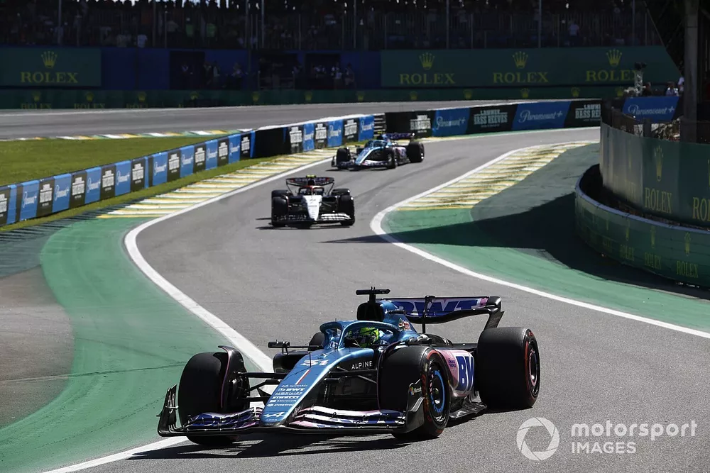 Esteban Ocon, Alpine A523, leads Yuki Tsunoda, AlphaTauri AT04, and Pierre Gasly, Alpine A523