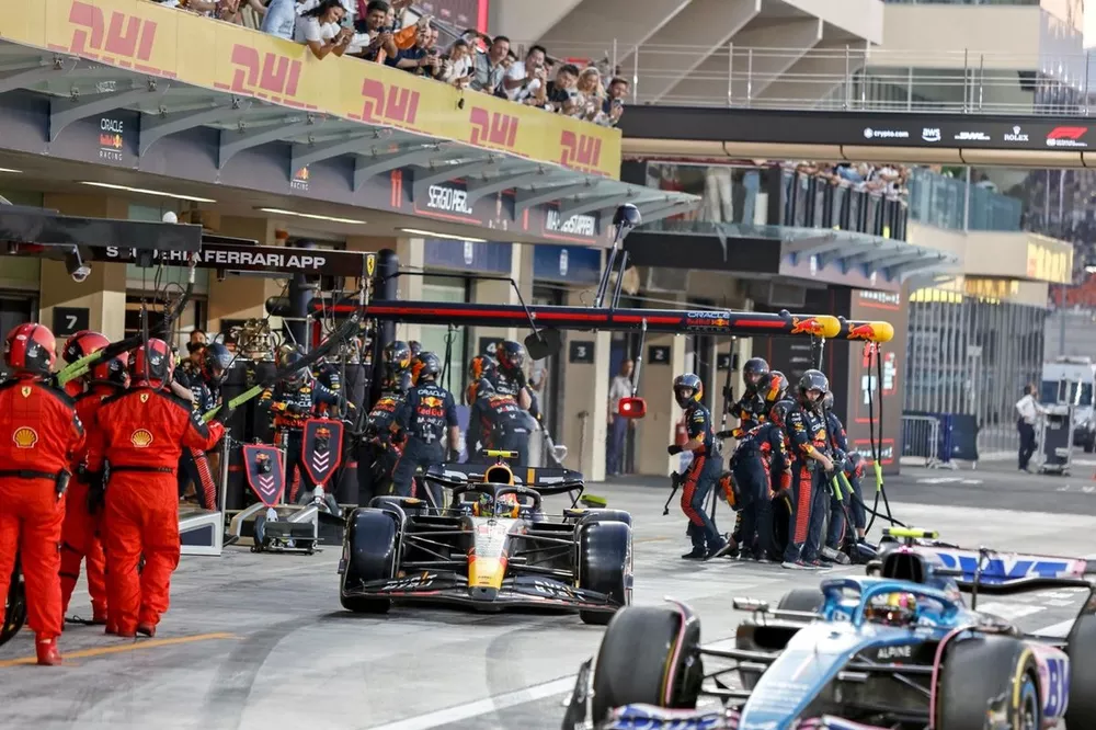 Sergio Perez, Red Bull Racing RB19, leaves the pits after a stop