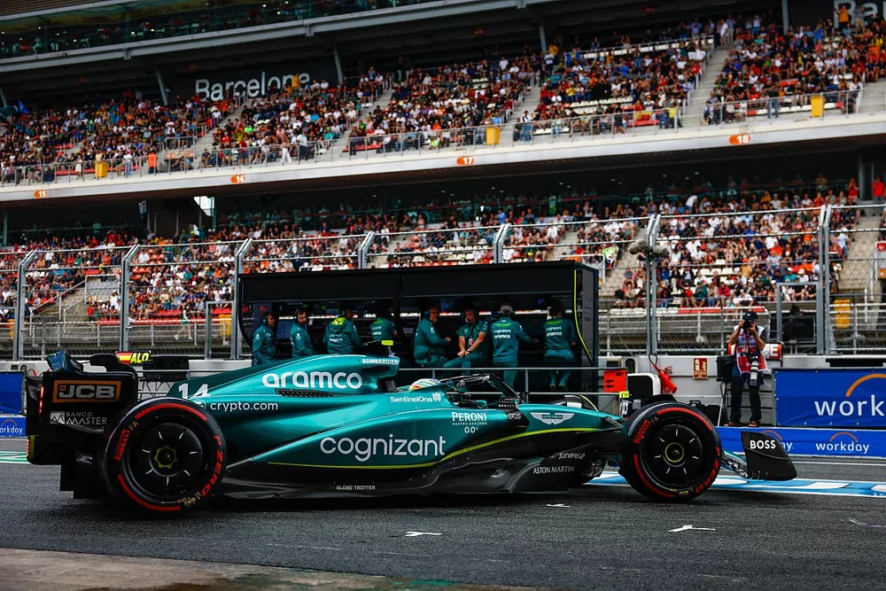 Fernando Alonso, Aston Martin AMR23, leaves the garage