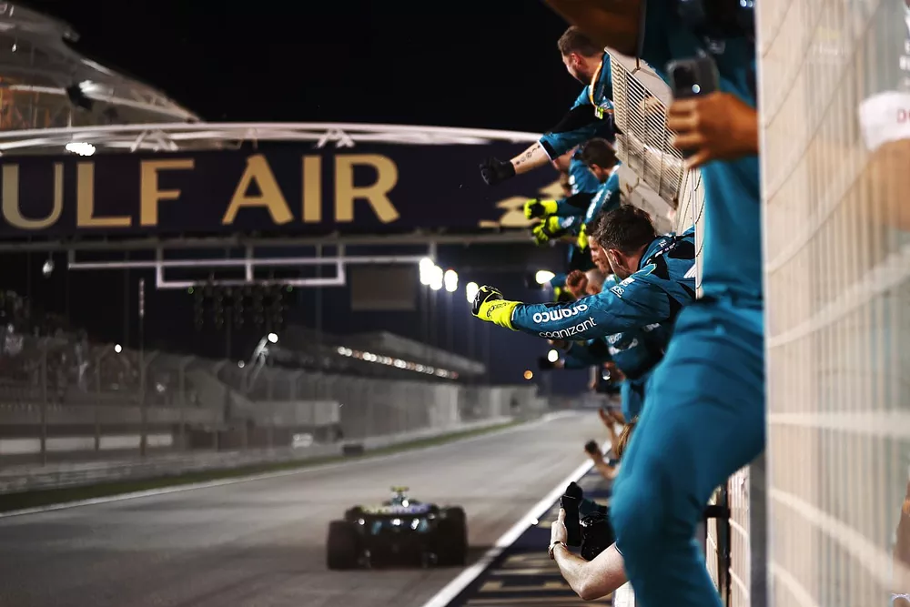 Fernando Alonso, Aston Martin AMR23, crosses the line to take 3rd position